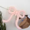 Nuevas decoraciones de globos con forma de lazo de corazón para crear un ambiente sofisticado de estilo coreano en cafeterías y pastelerías, perfectas para celebraciones de cumpleaños
