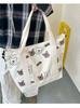 Bolso de hombro de lona de gran capacidad y combinable para estudiantes, bolso de compras portátil, bonito bolso con diseño de oso AB, venta al por mayor
