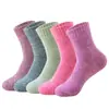 Calcetines de rizo para hombre otoño e invierno forrados de felpa engrosados cálidos para mujer de caña color liso calcetines de piso calcetines de toalla paralelos venta al por mayor transfronteriza
