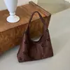 Bolsa de mão/ombro/transversal PU all-season floral vazada simples 2026 moda tendência personalizada para mulheres