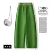 Calça casual verde sob medida de cintura alta com corte curvo para mulheres, estilo coreano, novo para o início do outono de 2026, amarração com cordão, corte para corpo em formato de pera, emagrecedor