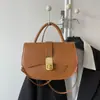 Versión coreana 2026 nueva moda alta calidad elegante versátil simple retro bolso de hombro cruzado bolso tipo silla de montar