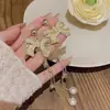 Aretes de borla con moño de diamantes completos, diseño de nicho, alta gama, elegantes, a la moda, aretes versátiles, venta al por mayor