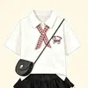 2026 Novo Estilo College Verão Doce Conjunto Moda Gola Polo Top e Elegante Conjunto de Duas Peças Saia Bolo para Meninas