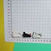 Lazo de Dibujos Animados Perro Blanco y Negro Accesorios Pequeños Zuecos DIY Funda de Teléfono Juguete Accesorios para Pasador de Pelo Decoración Parches