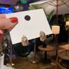 Pendientes de Plata Tejidos Huecos Estilo Frío Simple Elegantes Pendientes Puerta Han Dong Pendientes Femeninos Diseño de Nicho