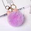 Lindo llavero con colgante de bola de pelo y orejas de conejo de moda, colgante de peluche para bolso de escuela, regalo para bolso de mujer, disponible al por mayor.