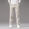 Nuevos Pantalones Casuales Elásticos para Hombre 2026, Primavera y Verano, Pantalones Ajustados Rectos Color Blanco Roto para Hombre, Pantalones Versátiles de Moda para Hombre