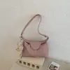 Bolso de hombro y axila de gran capacidad 2026 transfronterizo, bolso casual de moda nicho estilo coreano, bolso de mano tipo dumpling para mujer