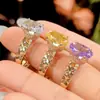 2026 Joyería Zhuangshengsheng Base de Cobre Chapada en Oro Piedra Preciosa Sintética Corte Flor de Hielo Anillo Cerrado con Acabado Dorado Cepillado para Mujer 8*12