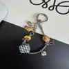 Cadena de hueso de serpiente para perro salchicha original correa para teléfono llavero lindo colgante de bolsa caricatura linda dopamina