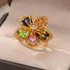 Anillo de flor de circón rojo incrustado exquisito transfronterizo 2024 nueva marea anillo de lujo de alto sentido una generación de cabello