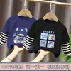 Camiseta de manga larga para niño, nuevo modelo primavera y otoño 2026, top estiloso para niños, camiseta base de moda de imitación de dos piezas para niños mayores
