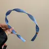 Exclusivo arco de cabelo de tecido em espiral para mulheres, design novo, arco simples e estiloso, sensação de alta qualidade, adequado para uso diário