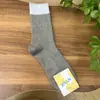 Calcetines de mujer a juego de terciopelo cálido de hilo de punto calcetines apilables estilo japonés de caña media Joker otoño e invierno cálidos INS moda al por mayor calcetines de algodón