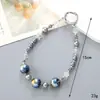 Ins Nuevo Colgante de Llavero con Lentejuelas y Lazo de Perlas para Funda de Teléfono Móvil Accesorios de Correa de Muñeca para Lanyard de Teléfono Móvil