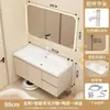 Tocador de baño color crema para espacios pequeños, con un gabinete estrecho, un lavabo de cerámica integrado y una combinación de gabinete para lavabo