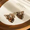 Pendientes de borla con carcasa de madera marrón transfronterizos europeos y americanos, pendientes de estilo vintage Maillard, pendientes de mujer de lujo ligero de alta gama
