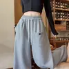 Tiro real Pantalones deportivos americanos 2026 Otoño/Invierno Nuevos Pantalones de pierna ancha para mujer Estilo perezoso holgado Pierna curva Casual Pantalones largos