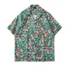 Cuello de solapa 2026 Estilo nuevo Camisa floral para hombre Estilo coreano Holgada Moda Estampada Estilo playero Casual Camisa de manga corta Exportación