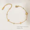 Pulseira de Aço Titânio Dourado Europeia e Americana de Venda Quente Transfronteiriça, Design de Trevo de Quatro Folhas Eletrodepositado em Ouro 18K, Joia de Luxo de Alta Qualidade Que Não Desbota