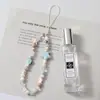 Nueva cadena de móvil con cuentas accesorios de estrella de mar de cerámica cordón para móvil cuerda para móvil femenina azul claro transfronteriza