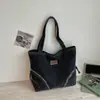 Bolsa de mano de mezclilla de gran capacidad estilo coreano Shuai Mi Jia para mamás, nuevo bolso de mano/hombro casual para principios de otoño de 2026