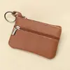 Billetera pequeña de color sólido de piel de vaca de capa superior, monedero portátil, mini ultra-delgada de cuero con cremallera, monedero para mujer, venta directa de fábrica