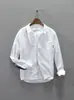 Camisa casual minimalista de manga larga estilo japonés para hombre, nueva colección otoño 2026, moda retro, versátil, corte holgado, diseño de retazos