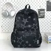 Mochila de estilo minimalista de alta gama con estampado de estrellas en tonos oscuros, refrescante y juvenil estilo americano, adecuada para estudiantes para la escuela y salidas, mochila escolar moderna y genial