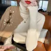 Suéter de cuello alto para mujer otoño e invierno 2026 nuevo estilo más vendido cuello holgado elegante prenda interior base de punto top