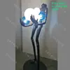 Lámpara de escultura abstracta de bola de personaje Lámpara de sala de exposiciones lámpara de oficina de ventas de hotel Lámpara de decoración artística lámpara de león lámpara de pie con forma humana