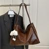 2025 Nuevo Retro Gran Capacidad Color Sólido Casual Simple Portátil Hombro Axila Tote Mochila de Mujer