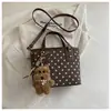 Bolsas de nicho transfronteiriças para mulheres, nova moda outono 2026 bolsa de ombro tipo balde de bolinhas, bolsa transversal para o dia a dia
