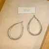 Pendientes de Diseño de Nicho de Lujo Ligero Estilo Francés Pendientes Ovalados Minimalistas de Plata Pendientes de Botón de Moda de Gama Alta