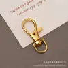 Fabricante fornece fechos de metal para cães, chaveiros criativos para bolsas, fechos de gancho DIY, fechos de boca de peixe de metal e acessórios no atacado.