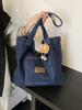 Bolso de hombro de lona vaquera para mujer, bolso de compras de gran capacidad, bolso de mano artístico de nicho, bolso informal japonés y coreano combinable con todo.