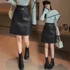 Falda de cuero mujer otoño invierno sentido del diseño dobladillo empalmado media falda falda midi de cuero de cintura alta falda línea A mujer color café