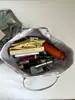 Bolsa de lona con estampado de leopardo para mujer, bolsa de gran capacidad, nuevo modelo 2026, bolso de mano de estrella transfronterizo, bolso de hombro para el trabajo, bolsa versátil