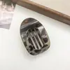 Nuevo Clip de Tiburón Curvo Elegante de Disco Plano Ovalado Nuevo para el Cabello Trasero Pinza para el Cabello con Diseño de Arco