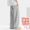 Calça de moletom esportiva cinza estilo americano com corte enviesado para homens, marca da moda, novo modelo de início de outono, corte reto solto, tamanho grande, calça longa casual versátil