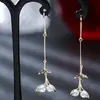 Brincos de pingente de metal em forma de cauda de peixe europeus e americanos transfronteiriços simples quando a atmosfera brincos geométricos longos de diamante femininos à vista