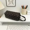 Bolsa de maquillaje acolchada con lunares rosas y azules estilo coreano transfronteriza, bolsa de tocador de viaje portátil de gran capacidad, bolsa de almacenamiento simple de mano