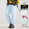 Calça de Trabalho Masculina Três em Um para Uso Externo, Jaqueta de Esqui com Forro de Penas, Calça Quente para Caminhada, Conjunto Feminino Destacável de Duas Peças, Calça de Assalto
