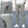 Pantalones casuales de verano nuevos, pantalones para hombre estilo K, pantalones modernos holgados de pierna recta para jóvenes, de algodón puro elástico color blanco hueso para hombre