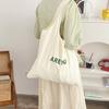 Bolsa de Lona Casual Versátil Estilo Coreano Impresión de Letras Nicho Gran Capacidad Bolso de Hombro Moda Fresca Bolso Sobaco para Mujer