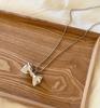 Collar colgante de metal con lazo de plata minimalista japonés y coreano para mujer, dulce, de alta gama, cadena individual para suéter, cadena para sudadera