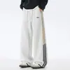 Calça de moletom listrada estilo americano, nova coleção de outono, caimento solto com caimento, bordado color-blocking, calça esportiva casual versátil