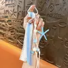 Llavero colgante de bolsa estilo Miu creativo, colgante personalizado de nicho, cinta de cuerda tejida, accesorio para mochila, pequeño regalo