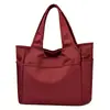 Bolso tote de gran capacidad para mujer para exportación, adecuado para ir al trabajo, un bolso de hombro moderno y a la moda de estilo coreano, un bolso de mano casual para mujer